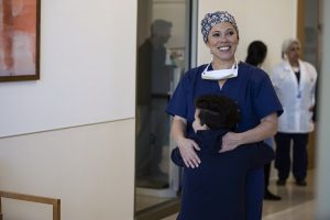 COUNCIL OF DADS -- "Heart Medicine" Episode 106 -- Pictured: (l-r) Blue Chapman as JJ Perry, Romi Dias as Dr. Pena -- (Photo by: Nathan Bolster/NBC)