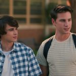 Sweet Magnolias characters Kyle and Ty at standing outside of Serenity High School. Cr. Courtesy of Netflix © 2023