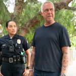 Bosch: Legacy characters Officer Reina Vasquez and P.I. Harry Bosch standing and looking to the right